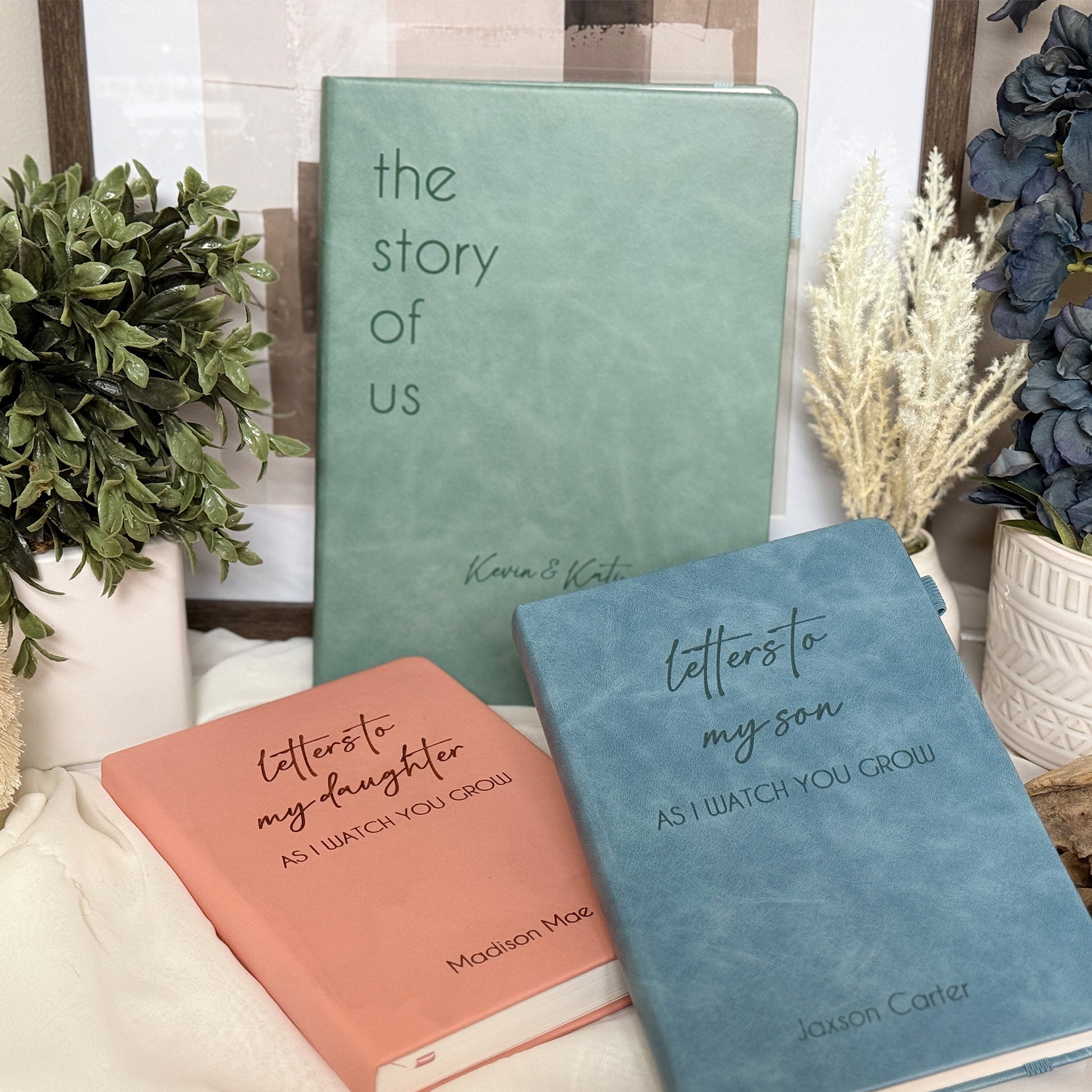 Personalized leather journal in blue, green, and pink with customizable engravings.