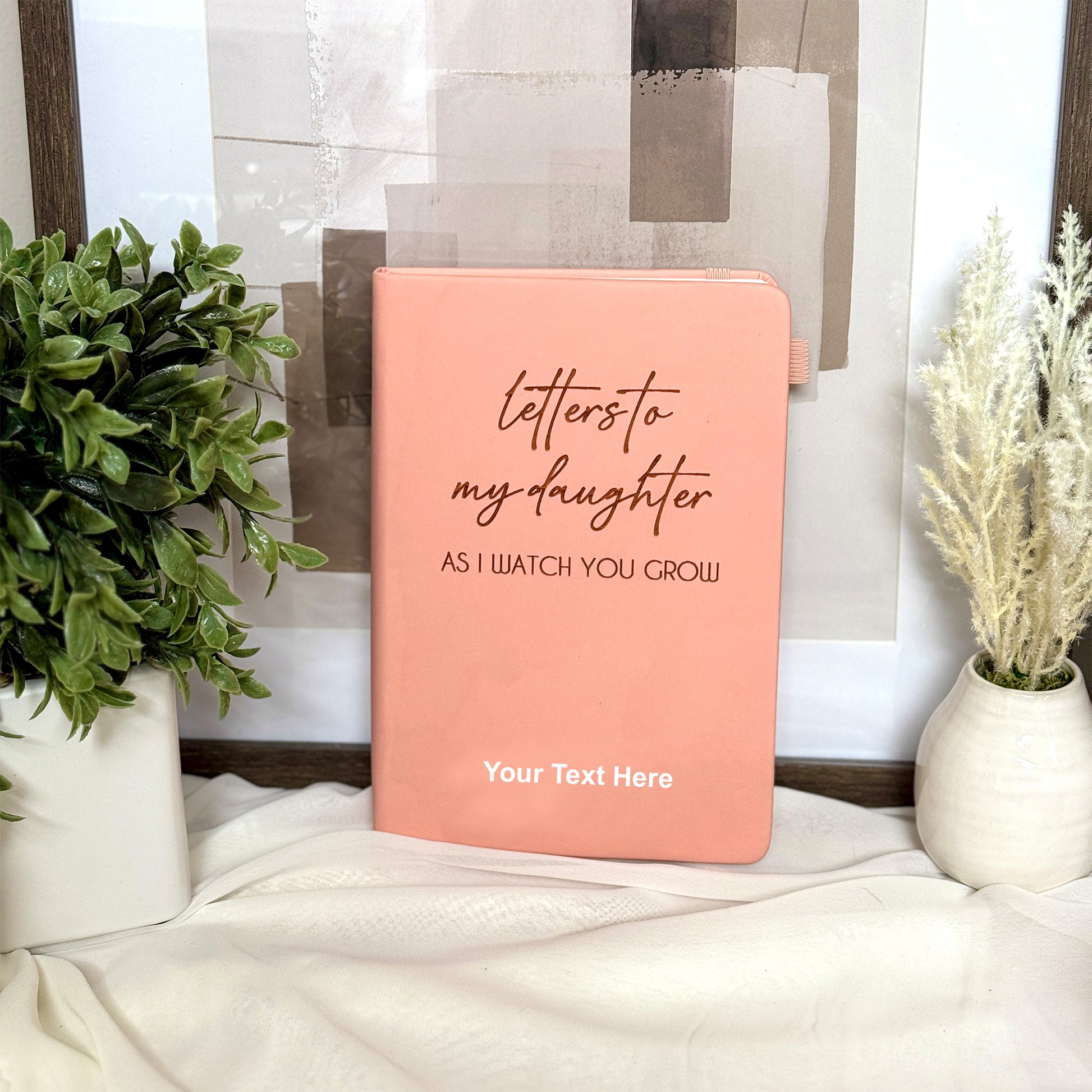 Engraved leather journal with the option for customization, ideal for a daughter or family.