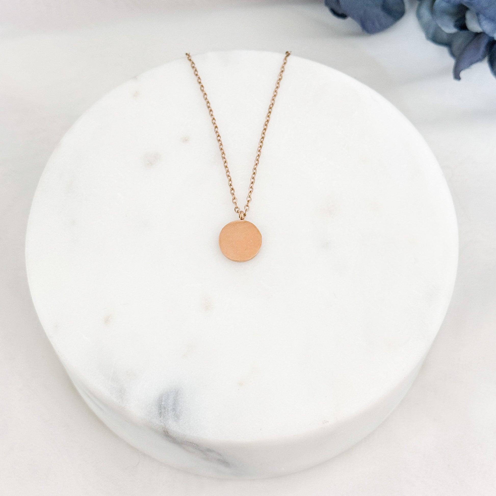 Petite round necklace with customizable engraving for a personalized keepsake.