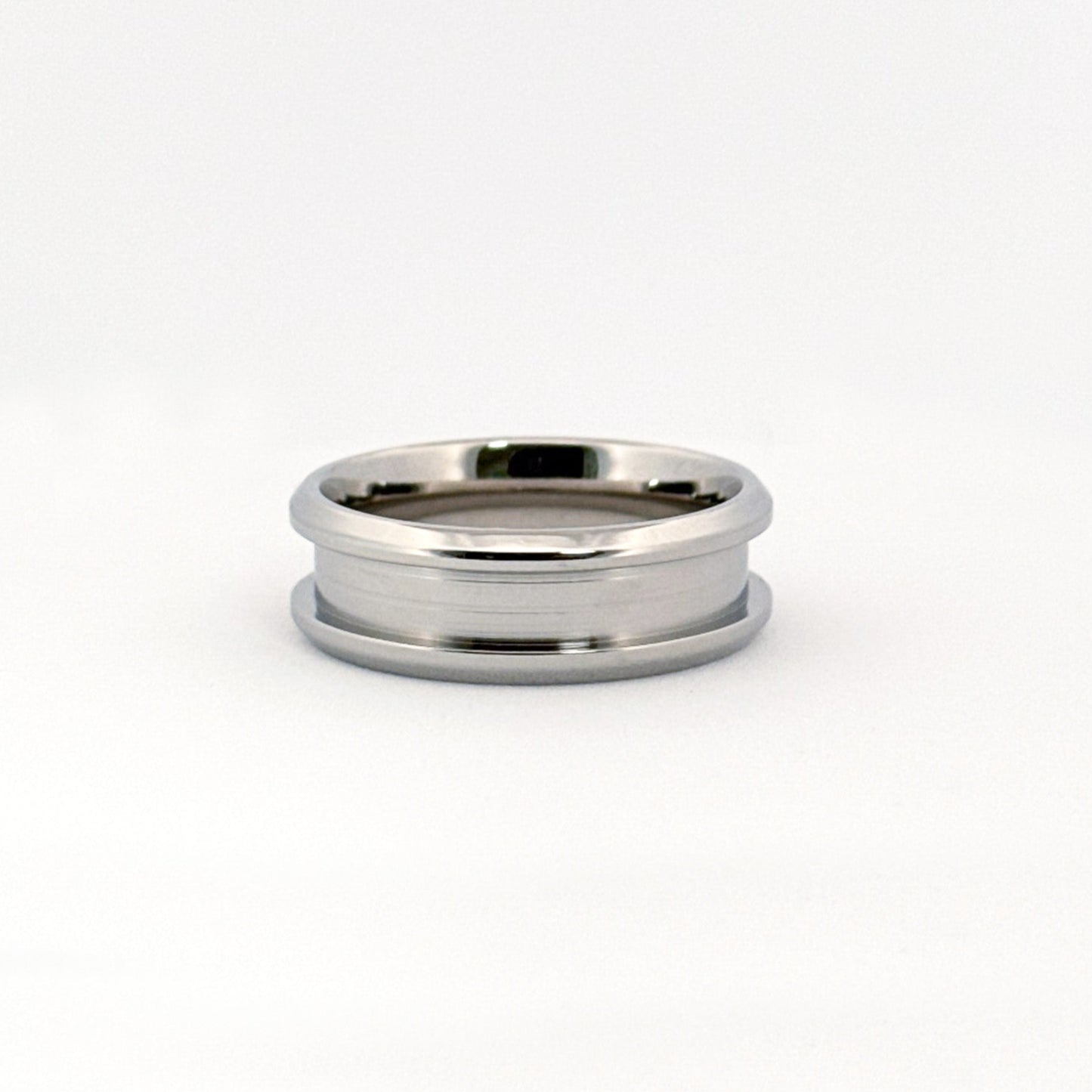 The Carter Ring in stainless steel, featuring beveled edges and multiple width options.