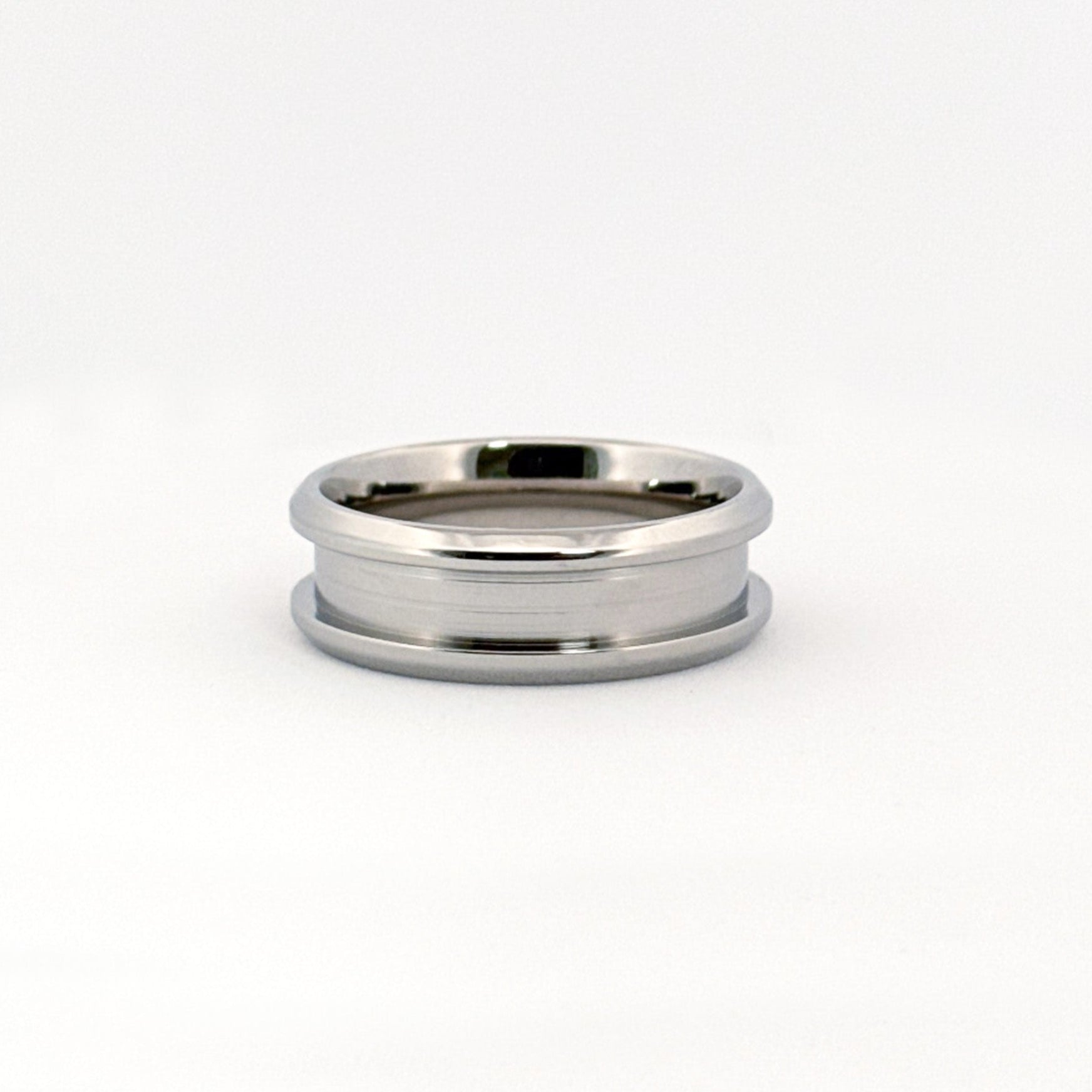 The Carter Ring in stainless steel, featuring beveled edges and multiple width options.