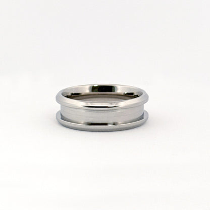 The Carter Ring in stainless steel, featuring beveled edges and multiple width options.