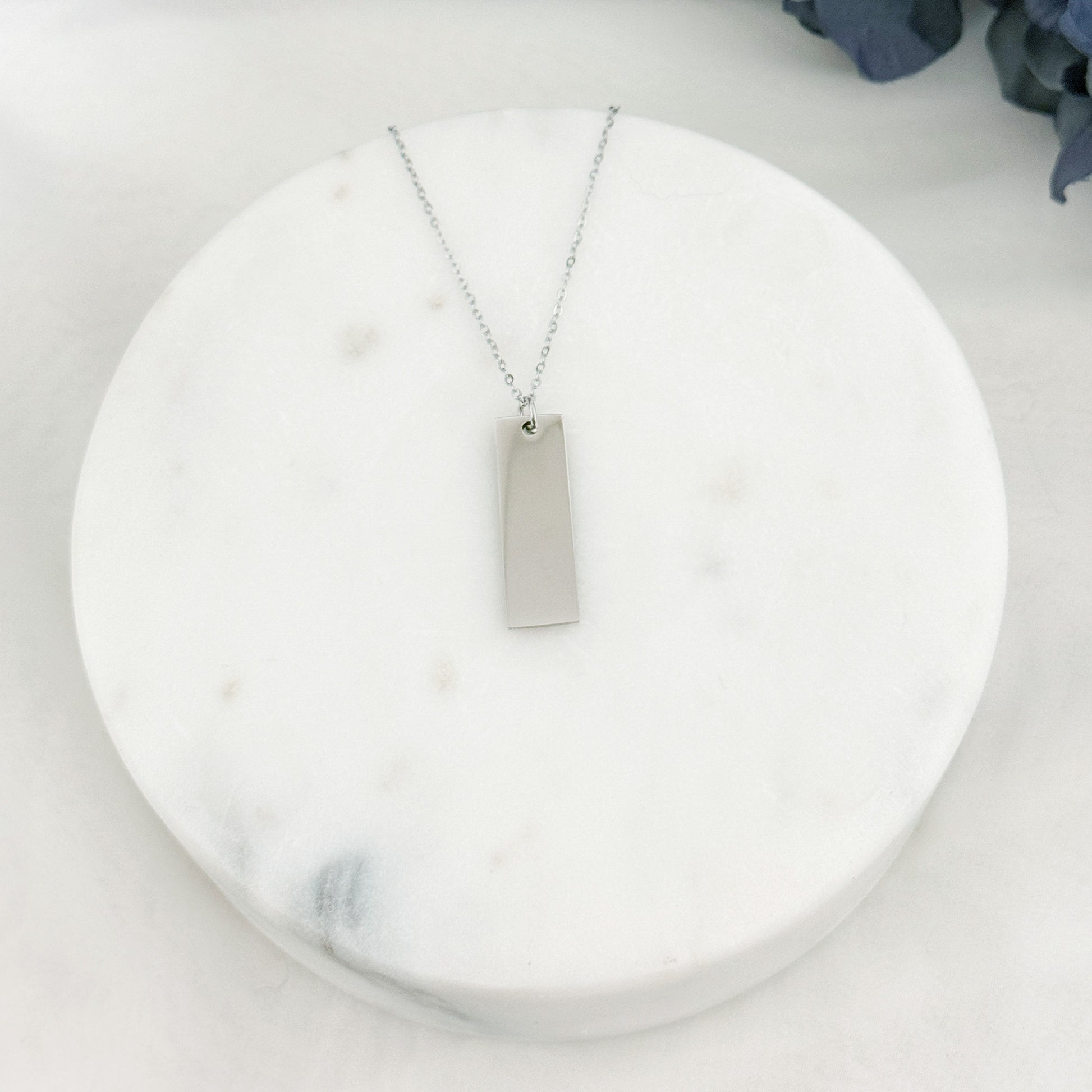 Wide rectangle bar necklace with customizable engraving on one or both sides.