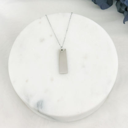 Wide rectangle bar necklace with customizable engraving on one or both sides.